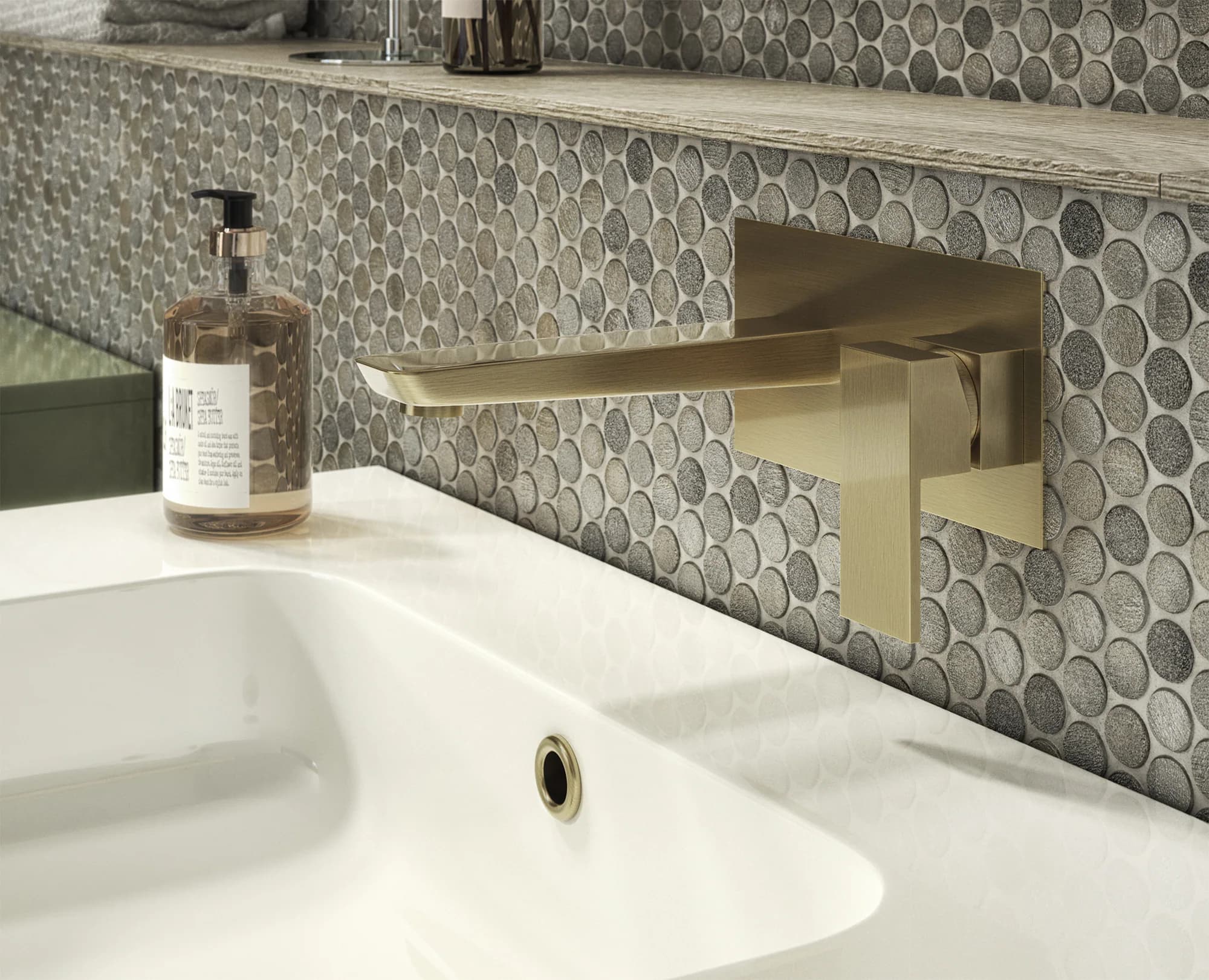 Close-up bathroom CGI showing a brushed-brass basin mixer and vanity finish detail